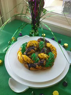 Braided pastry with green and purple icing