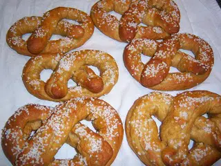 Salted soft pretzels on white cloth