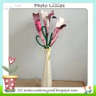 Pink paper lilies bouquet in cream ceramic vase