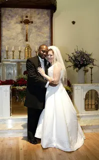 Bride and groom embracing during wedding ceremony