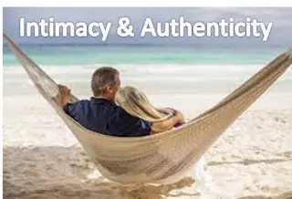 Couple relaxing in hammock on sandy beach