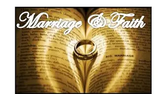 Wedding ring casting heart shadow on Bible