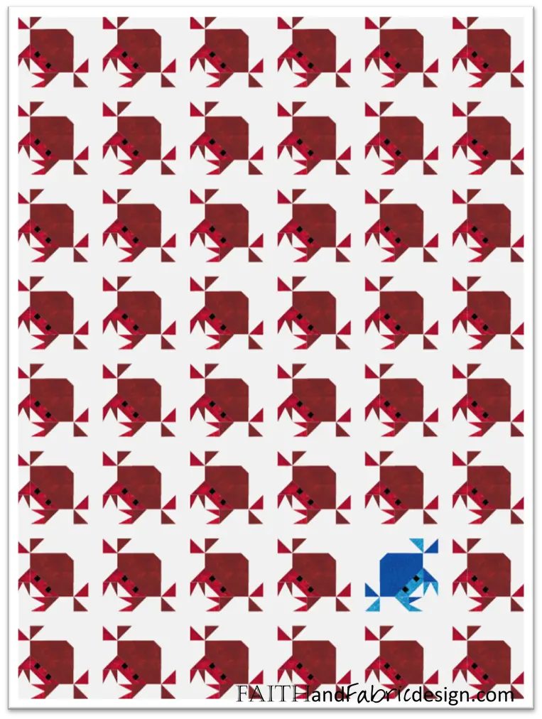 One blue fish among red origami fish