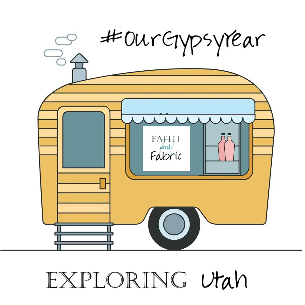 Yellow camper trailer with Faith and Fabric sign